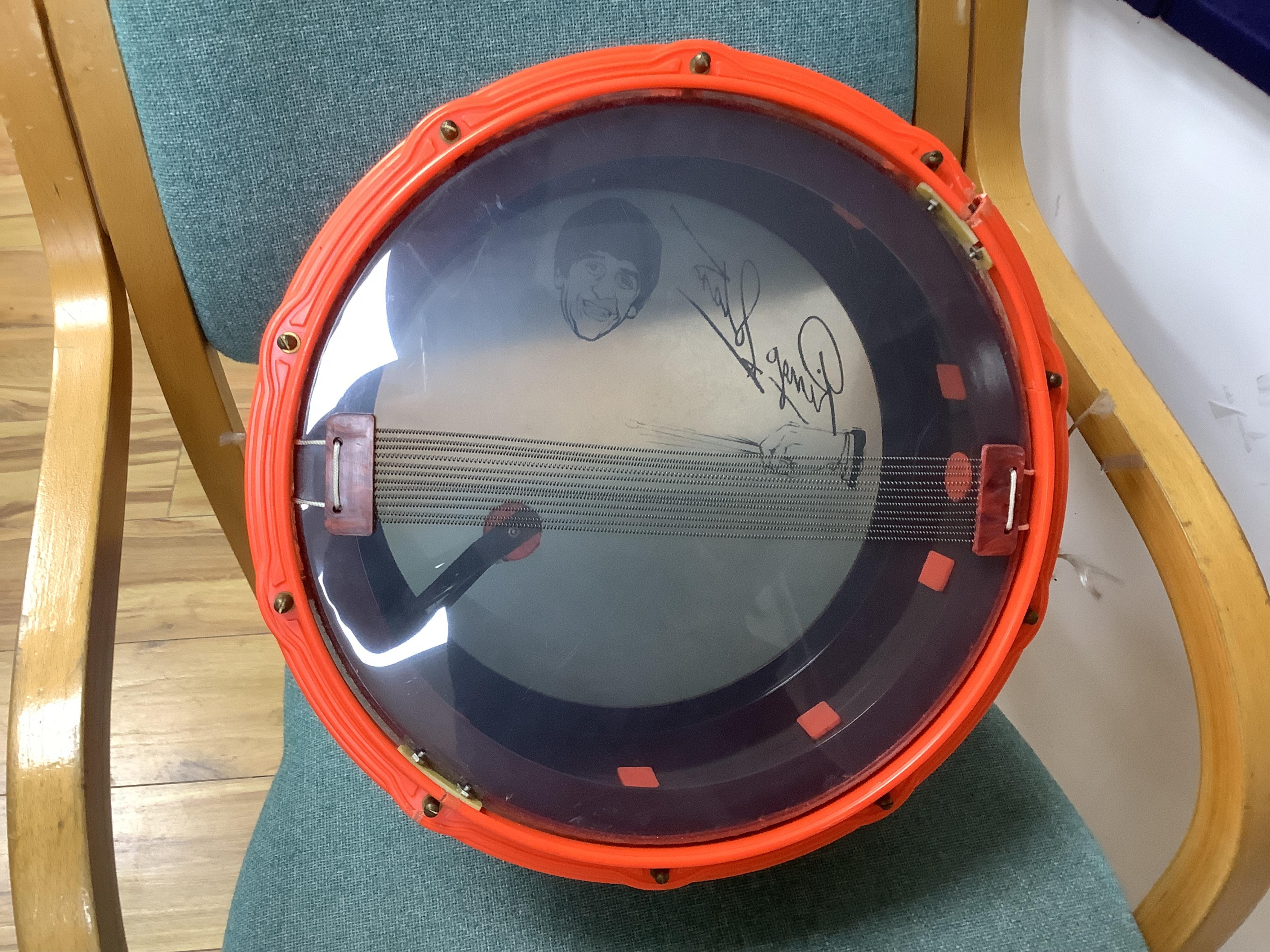 A 1960's Beatles child's plastic drum set in the original card box comprising of a snare drum on a stand, a card cut out bust of Ringo Starr, two 1960s Beatles jigsaws (unchecked) and a Beatles inflatable ball